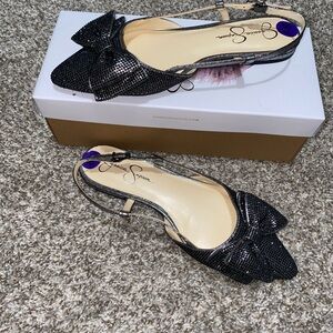 Slide-on dress shoe with heel strap